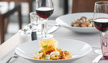 Set table in the restaurant with Mediterranean dishes